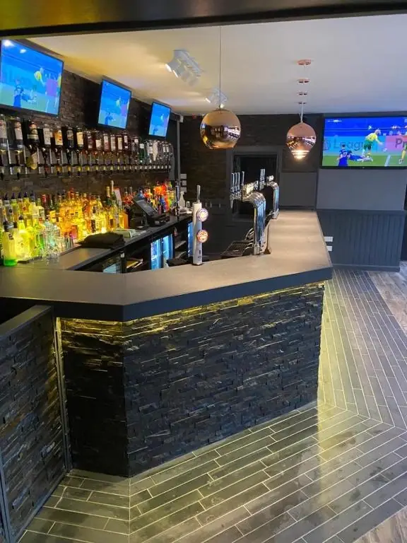The Windsor Hotel bar with extensive spirits selection, beer taps and big-screen live sport